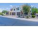 Two story home with two car garage and landscaped yard at 36131 N Desert Tea Dr, Queen Creek, AZ 85140