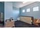 Small bedroom with window and simple furnishings at 36131 N Desert Tea Dr, Queen Creek, AZ 85140