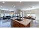 Open concept kitchen with island, stainless steel appliances, and ample counter space at 36131 N Desert Tea Dr, Queen Creek, AZ 85140