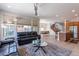 Open living room features a spacious layout with ample natural light and a view of the kitchen and dining area at 36131 N Desert Tea Dr, Queen Creek, AZ 85140