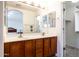 Bathroom with double vanity and large mirrors at 412 E Dartmouth Dr, Casa Grande, AZ 85122