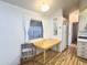 Bright dining area with wood table and chair near kitchen at 155 S Limestone Dr, Apache Junction, AZ 85119