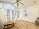 Bright living room with large windows and laminate flooring at 155 S Limestone Dr, Apache Junction, AZ 85119