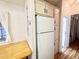 White appliances and cabinets highlight this galley-style kitchen at 155 S Limestone Dr, Apache Junction, AZ 85119