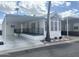 Single wide manufactured home with carport and landscaping at 155 S Limestone Dr, Apache Junction, AZ 85119