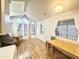 Bright living room featuring hardwood floors, bay window, and ceiling fan at 155 S Limestone Dr, Apache Junction, AZ 85119