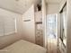 Cozy bedroom with mirrored closet doors and access to the living area at 155 S Limestone Dr, Apache Junction, AZ 85119
