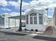 Inviting manufactured home with carport and landscaped yard at 155 S Limestone Dr, Apache Junction, AZ 85119