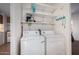 Convenient laundry room with washer, dryer, and shelving at 2121 N Center St # 86, Mesa, AZ 85201