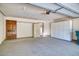 Attached garage with ample storage shelving and a large door at 5732 N 25Th St, Phoenix, AZ 85016