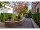 Landscaped courtyard with brick pavers and colorful flower pots at 8100 E Camelback Rd # 178, Scottsdale, AZ 85251