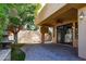 Covered patio with ceiling fan, heater, and access to backyard at 8100 E Camelback Rd # 178, Scottsdale, AZ 85251