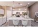 Modern kitchen with white cabinets, quartz countertops, and island at 1145 N 293Rd Ave, Buckeye, AZ 85396