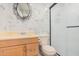 Updated bathroom with marble tile and a large walk-in shower at 5921 W Golden Ln, Glendale, AZ 85302
