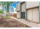 View of building exterior with gated entrance and walkway at 5921 W Golden Ln, Glendale, AZ 85302