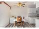 Bright dining area with wood table and chairs, and kitchen with granite countertops at 5921 W Golden Ln, Glendale, AZ 85302
