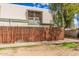 Exterior view of a two-story home with wood fence at 5921 W Golden Ln, Glendale, AZ 85302
