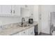 Modern kitchen featuring granite countertops and stainless steel appliances at 5921 W Golden Ln, Glendale, AZ 85302