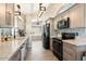 Modern kitchen with stainless steel appliances and granite countertops at 14194 W Mountain Laurel Trl, Surprise, AZ 85374