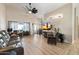 Spacious living room with light flooring, comfy seating, and a large TV at 14194 W Mountain Laurel Trl, Surprise, AZ 85374