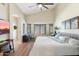 Spacious main bedroom with large windows and ceiling fan at 14194 W Mountain Laurel Trl, Surprise, AZ 85374