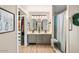 Updated bathroom with double vanity and walk-in shower at 14194 W Mountain Laurel Trl, Surprise, AZ 85374