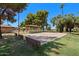 Community shuffleboard court with a covered seating area at 14194 W Mountain Laurel Trl, Surprise, AZ 85374