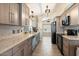 Modern kitchen with stainless steel appliances and granite countertops at 14194 W Mountain Laurel Trl, Surprise, AZ 85374