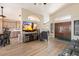 Open living area with hardwood floors, kitchen and dining area views, and a modern aesthetic at 14194 W Mountain Laurel Trl, Surprise, AZ 85374