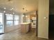 Kitchen with island and access to screened patio at 437 E Germann Rd # 63, San Tan Valley, AZ 85140