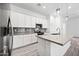 Modern kitchen with white cabinets and gray countertops at 901 S Smith Rd # 1012, Tempe, AZ 85281