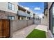 Shared backyard space with grassy area and block wall at 901 S Smith Rd # 1012, Tempe, AZ 85281