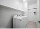 Laundry closet with washer, dryer, and overhead shelving at 901 S Smith Rd # 1012, Tempe, AZ 85281
