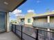 Private balcony overlooking community; metal railing and partial view of courtyard at 901 S Smith Rd # 1012, Tempe, AZ 85281