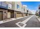 Modern townhouses with attached garages and a shared driveway at 901 S Smith Rd # 1012, Tempe, AZ 85281