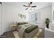 Bright bedroom with a green comforter and a ceiling fan at 901 S Smith Rd # 1012, Tempe, AZ 85281