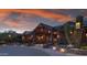 Luxury clubhouse exterior at sunset, showcasing architectural details at 42035 N 113Th Way, Scottsdale, AZ 85262