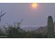 Full moon over city lights with desert landscape in foreground at 42035 N 113Th Way, Scottsdale, AZ 85262