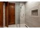 Spa-like bathroom with walk-in shower, modern fixtures, and laundry alcove at 42035 N 113Th Way, Scottsdale, AZ 85262