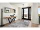 Bright entryway with modern console table and large mirror at 42035 N 113Th Way, Scottsdale, AZ 85262