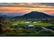 Desert Mountain golf course at sunset, showcasing stunning mountain views at 42035 N 113Th Way, Scottsdale, AZ 85262