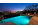 Expansive pool and spa at night with scenic sunset views at 42035 N 113Th Way, Scottsdale, AZ 85262