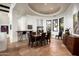 Elegant dining room with stone floors and wine storage at 42035 N 113Th Way, Scottsdale, AZ 85262