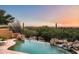 Expansive pool with waterfall feature and breathtaking sunset views at 42035 N 113Th Way, Scottsdale, AZ 85262