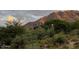 Luxury home nestled in desert landscape with mountain backdrop at 42035 N 113Th Way, Scottsdale, AZ 85262
