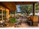 Outdoor patio with seating, dining area, and built-in grill at 42035 N 113Th Way, Scottsdale, AZ 85262