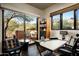 Home office with a view, built-in desk, and sliding glass doors to patio at 42035 N 113Th Way, Scottsdale, AZ 85262
