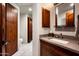 Bathroom with vanity, sink, and wooden cabinets at 42035 N 113Th Way, Scottsdale, AZ 85262