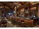 Elegant bar with rich wood finishes and comfortable seating at 42035 N 113Th Way, Scottsdale, AZ 85262