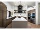 Modern kitchen with large island, stainless steel appliances, and custom cabinetry at 42035 N 113Th Way, Scottsdale, AZ 85262